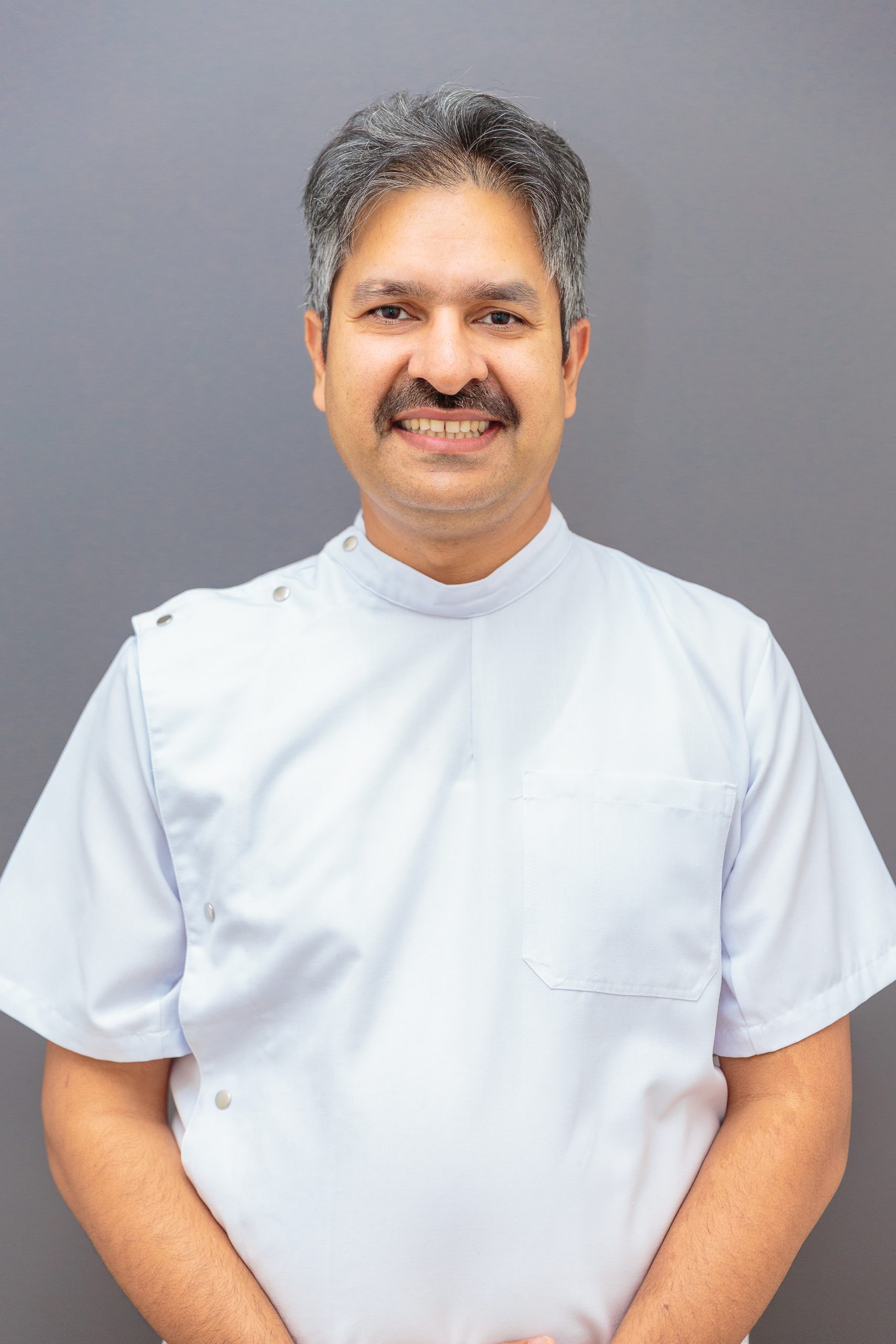 Associate DentistDr. Pat PandeyDr. Pat Pandey enjoys forming long-term relationships with his patients through open communication and personalised care. He focuses on preventive and restorative dentistry, aiming to create healthy and functional smiles with a conservative approach. With a professional yet friendly demeanour, Dr. Pandey checks that every patient understands their options and feels comfortable at each appointment. His goal is to make dental visits more relaxed and rewarding for the whole family.